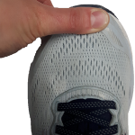 Thumb on the end of the shoe indicating the correct length of a shoe