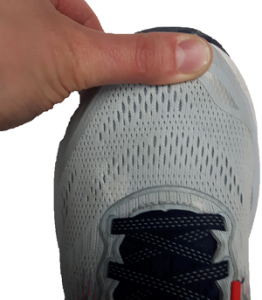 Thumb on the end of the shoe indicating the correct length of a shoe