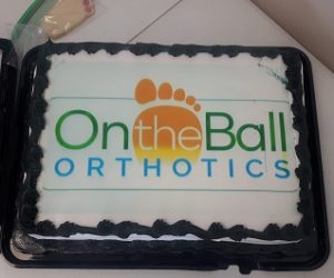 On the Ball Orthotics logo on a cake