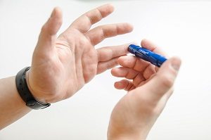 Finger prick to test blood sugar for those with diabetes