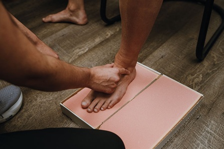 Casting the foot for custom foot orthotics using a foam impression box